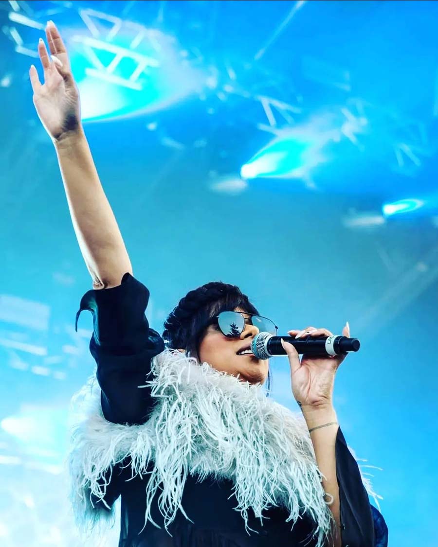 The little feather vest. Ladi6 wearing feather vest